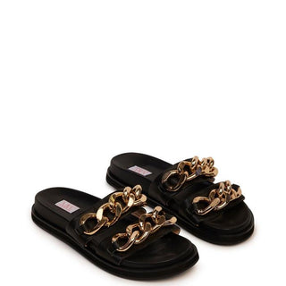 Verona slide in black by Kathryn Wilson is the go-to sandal of the season. Made with calf leather, this slide features two chunky, gold chains over the toe straps.