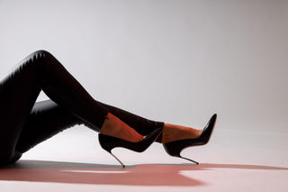 Casadei, Scarpa Blade, Black patent leather stiletto heel with a silver heel and pointed toes modelled with feet and legs styled with black leather pants, The Shoe Curator
