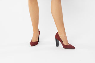 Capelli Rossi, Helena, Maroon suede stiletto with black patent block heel and pointed toes modelled on feet and legs, The Shoe Curator