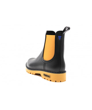 Black ankle gum boot welly wellington boot with orange ocra side elastic panels chealsea boot style rubber orange grip sole small blue verbena logo on heel