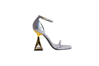 Kat Maconie glossy silver leather sandal heel, with spaghetti strap over the toes and around the ankle. Gold heels stacked on a crystal gem in the heel