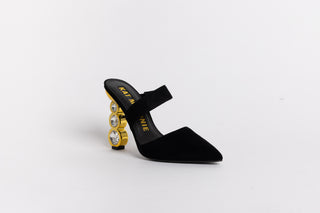 Black suede pointed closed toe Kat Maconie mule, with a-symmetrical strap over arch of foot stacked on 3 crystal gold heels