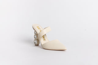 Cream leather,  pointed closed toe Kat Maconie mule with a symmetrical strap over arch of foot stack on 3 crystal heel 