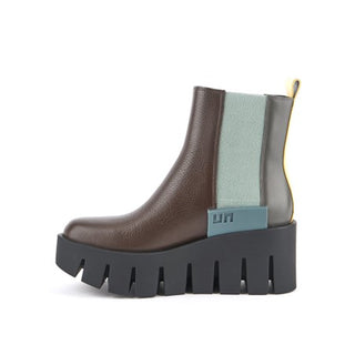  United Nude brown leather platform boot with yellow and blue features and a black lug sole