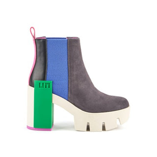 Suede gray boot with white lug sole, green statement block, electric blue elastic pull and pink and black features