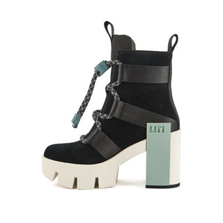 Black suede and neoprene tie up boot, with a light blue statement logo block and a white platform lug sole