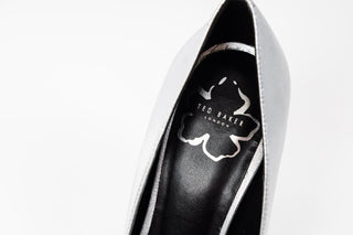 Ted Baker, Silveyy, Silver patent stiletto heel with pointed toes and a bow on the front, The Shoe Curator