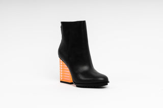 United Nude, Hi Rise, Black leather patent boot with zip and black sole thread with a see through orange heel, The Shoe Curator