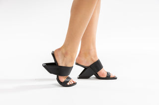 United Nude, loop Hi, Black leather sandal/heel with thick strap and as a heel, 2 in 1 modelled with feet and legs, The Shoe Curator.