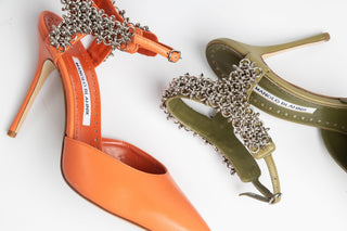 Manolo Blahnik, Skelli, Orange leather pointed toe stiletto with adjustable ankle strap with silver chain detailing modelled with other green skelli, The Shoe Curator