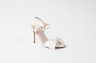 Ted Baker, Bribria, White leather pump with stiletto heel and bow cover on the peeped toes and with buckle around ankle, The Shoe Curator