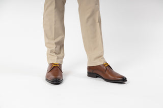 Fluchos, Shane, Light brown leather slim suqred toe shoe with dark stiching and dark laces modelled with feet and legs, The Shoe Curator