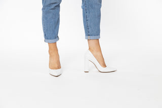 Capelli Rossi White croc patterned leather pump with pointed toes and a block heel styled with jeans and modelled with legs and feet, Gee, The Shoe Curator