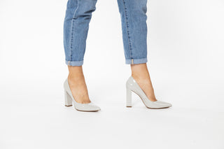 Capelli Rossi light grey patent pump with pointed toes and a block heel styled with jeans modelled with feet and legs, Kathleen, The Shoe Curator