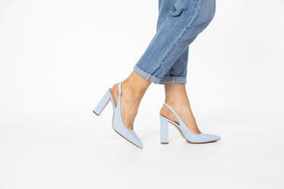 Capelli Rossi pastel baby blue leather slingback pump with pointed toes and block heel styled with jeans modelled with feet and legs, Maggie, The Shoe Curator