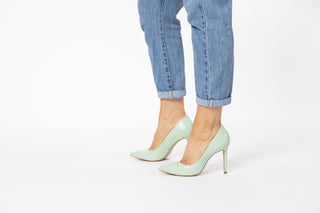 Capelli Rossi pastel green leather pump with pointed toes and stiletto heel styled with jeans and modelled with legs and feet, Rachel, The Shoe Curator