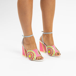 Kat Maconie, Carmel, pink leather heel with multi-coloured flower desgin, kicker block heel with gold detailing and pink inside modelled with legs and feet, the Shoe Curator