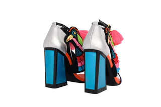 Kat Maconie, Aya, Blues and pinks leather pump with block heel and pop pom detailing and peeped toe and bird design out of tassels and sequences with adjustable ankle strap, The Shoe Curator