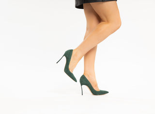 Casadei, Scarpa Blade, Green Suede stiletto with pointed toes and a thin green heel modelled with feet and legs styled with leather skirt, The Shoe Curator