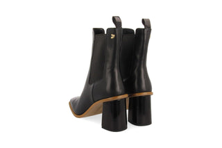 Gioseppo, Yala, Black leather ankle boot with pointed toes and brown rubber sole with elastic chunk and sharp edged block heel, The Shoe Curator
