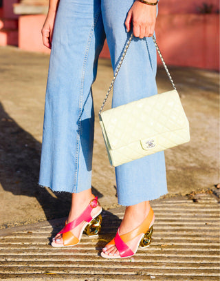 Kat Maconie, Tosca, Orange and pink leather stiletto with v cut and crossover of materials and a gold patent chain heel styled with jeans and gucci handbag and modelled with feet and legs, The Shoe Curator