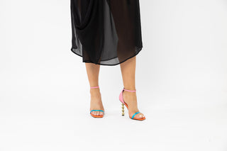 Kat Maconie, Erin Cream, Multicoloured, pink, orange and blue, leather shoe with open toe strap and adjustable ankle strap with gold chain stiletto heel styled with black dress and modelled with feet and legs, The Shoe Curator