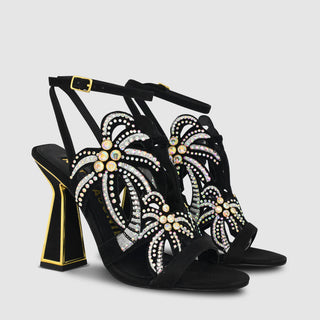 Kat Maconie, Kiawa, Black suede with open toes and palm tree details with gems and sparkles, thin black adjustable strap and hourglass heel with gold edging, The Shoe Curator