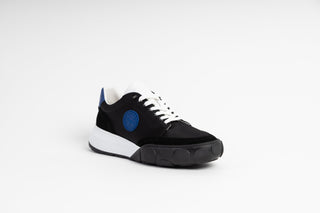 Ted Bake, Areli, Black and white sneaker with white laced and white sole with blue detailing at the front and back, The Shoe Curator