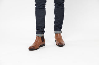 Ted Baker, Maisonn, Brown ankle boots with pointed toes and dark brown elastic on the sides styled with jeans and modelled with feet and legs, The Shoe Curator