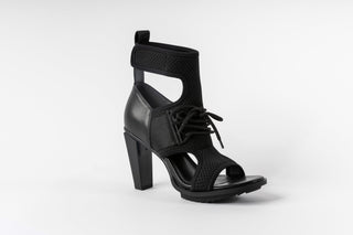 United Nude, Lev Normad Hi, Black leather and mesh boot with lace on the front, velcro on the side and cut outs at the bottom and top, peeped toe and floating block heel, The Shoe Curator